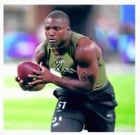 Los Angeles Rams linebacker Byron Young (0) runs during the first half of  an NFL preseason