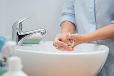 Woman washing hands