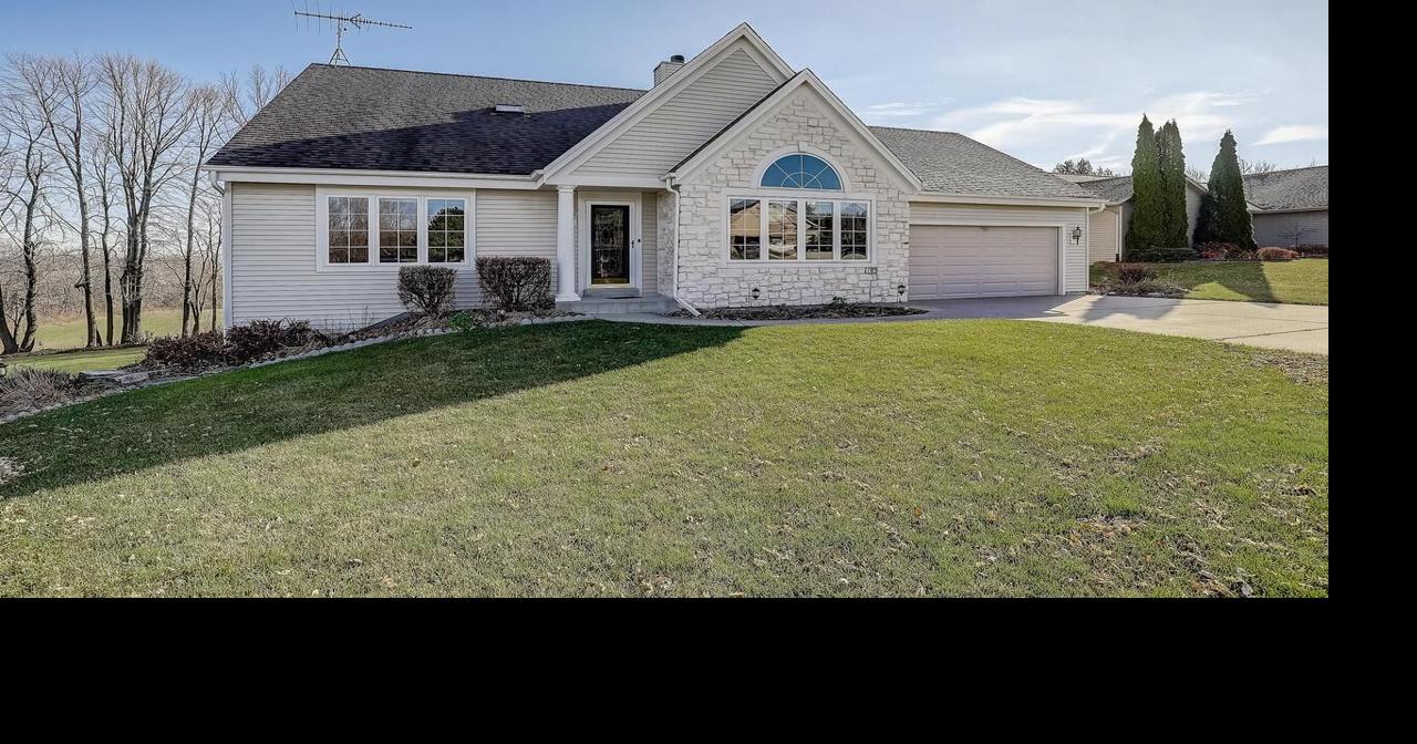 A twostory, doublesided gas fireplace and expansive deck highlight