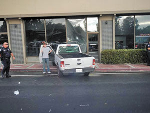 Truck collides with Belmont building in Belmont