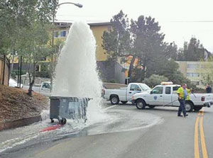 Runaway dumpster shears off fire hydrant in Belmont