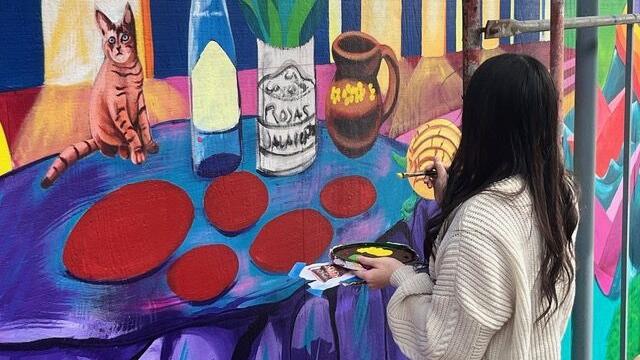 Baden High School mural celebrates belonging: Students work with professional muralists to brighten beige walls on campus in South San Francisco