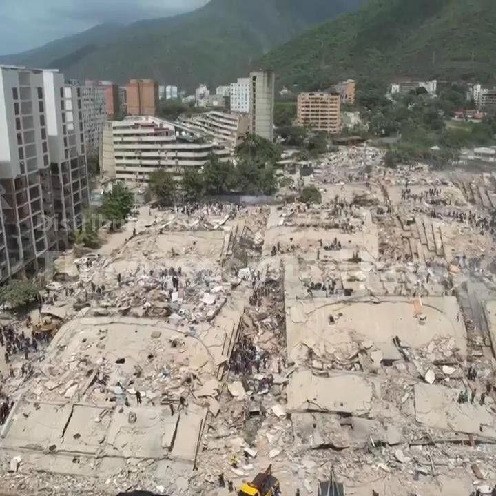 Drone video shows search through rubble of collapsed buildings in quake-hit La Guaira, Venezuela