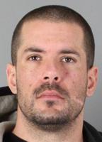 Man arrested after stealing purse from unlocked car