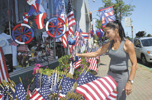Decking your home with red, white and blue: Patriotic owner of Judy’s Flag City offers wide selection