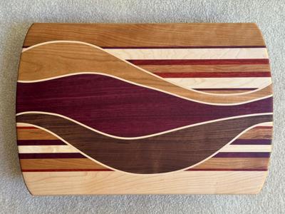 ChrisToulson_CatchTheWaveCharcuterieBoard_VariousHardwoods_12x18.JPG