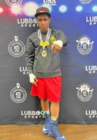 Steve Johnson, who fights out of San Mateo's B Street Boxing, brings home gold