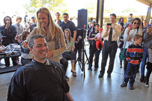 A student-funded buzz cut: Peninsula High School's principal has head shaved