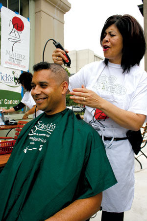 Shear determination: Councilman, others shave head for pediatric cancer