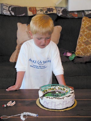 Little boy wishes on a baseball
