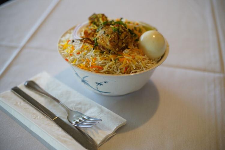 Chicken biryani, a beloved dish that is served at Peacock's Koriander Indian Cuisine.JPG