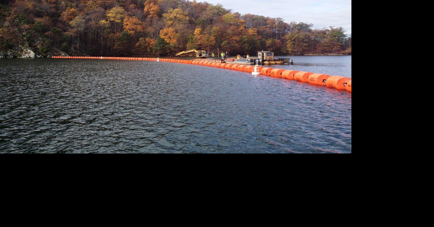 New floating barrier protects boaters from dam