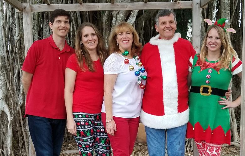 Phil Marraccini with his wife Patty and their three  children outside of their Phil’s Berry Farm.