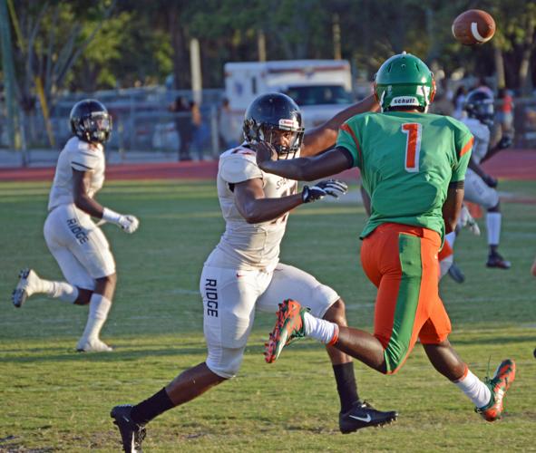 Southridge’s  Nigel Long chasing down Ely’s quarterback.