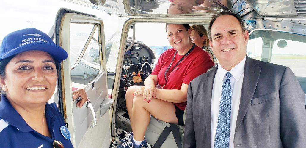 Yogini Modi (left), owner of the Homestead General Aviation Pilot Training Center and Homestead Mayor Steve Losner greet Jeri Barrientos, pilot of the Air Race Classic Angel Wings team on her arrival to the final stop of the race in Homestead on Friday,...