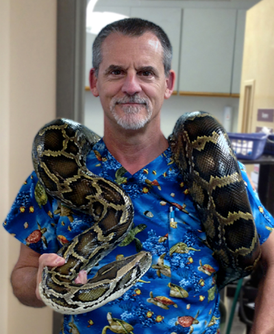 Veterinarian and author Dr. Douglas Mader, pictured with a python, will present at CFK’s VIP Series event on March 15 at the Upper Keys Center.