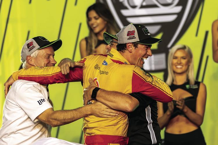 Joey Logano celebrates his championship