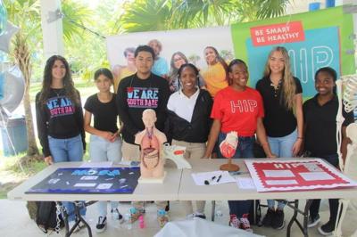 Members of the South Dade High Health Information  Project and Health Occupations Students of America.