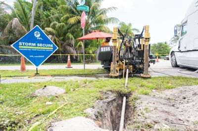 Crews replace overhead neighborhood power lines with underground lines in a Miami neighborhood May 9 to improve resiliency during hurricanes and severe weather and also enhance reliability during day-to-day conditions.