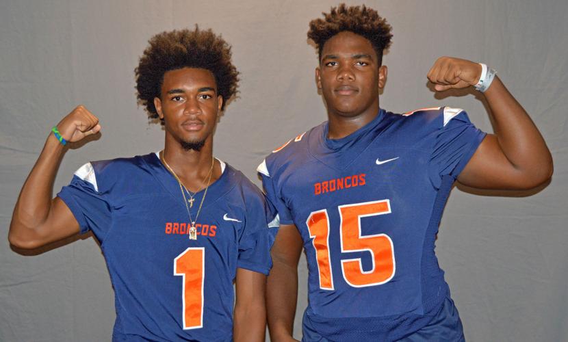 Homestead’s Tasheem Reese (1) and Greg Pruitt (15)