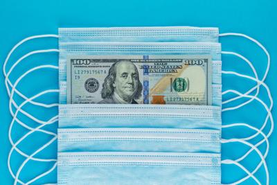 Blue medical masks, and american money, top view
