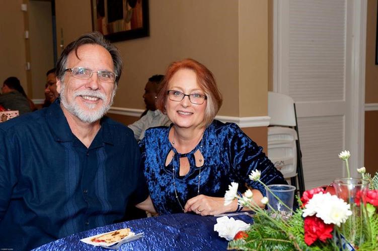 Pastor Rick Lee with is wife Debbie at a Christmas party.