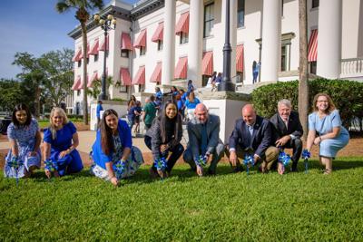 Planting symbolic pinwheels at Florida’s Historic Capitol.