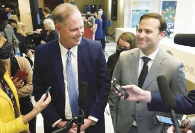 Senate President Wilton Simpson, left, and Speaker of the House Chris Sprowls smile as they speak with members of the media after the end of a legislative session, Friday, April 30, 2021, at the Capitol in Tallahassee, Fla.