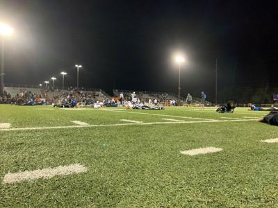 Players, coaches, officials and press lay flat on the field, as play was stopped in the fourth quarter after a fight in the stands caused a scare of a shooting.