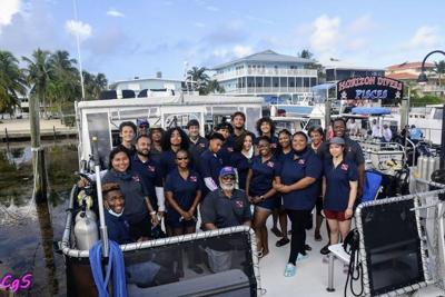 Lead instructors Chris Searles (front in blue cap) and Ernie Franklin (back in blue cap) teach and mentor the 2021 Youth Diving With a Purpose group continuing to learn about marine archeology and support Biscayne National Park.