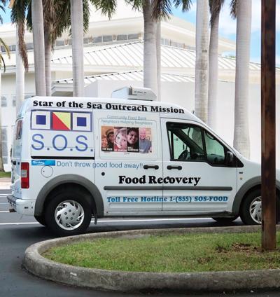 SOS has seven refrigerated vans and trucks that visit local grocers and businesses for food recovery, such as this one at St. Justin.