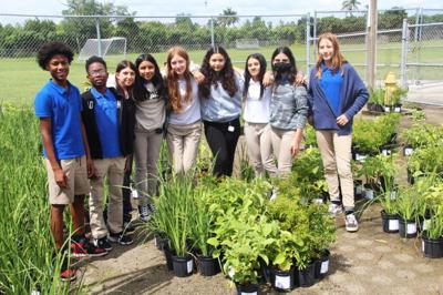 Redland Middle School students with some of the plants they displayed at the Miami Dade Fair and Exposition. There were 76 students who participated.