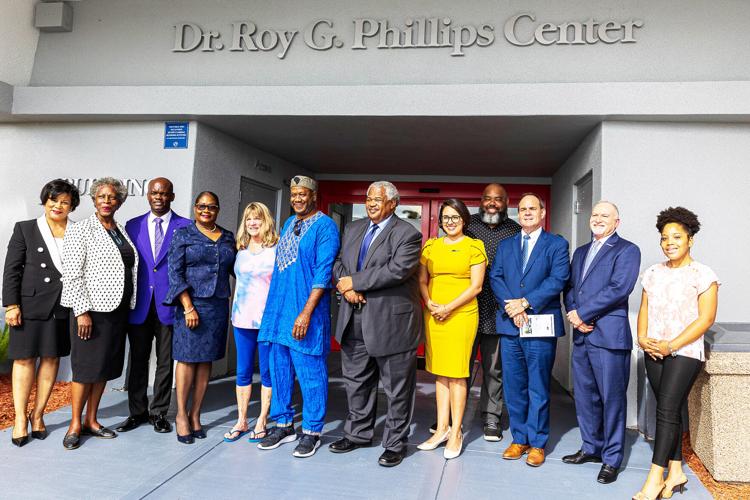 Miami Dade College Leaders ae joined by Dr. Phillips’s family, Carmen Morris, Past Homestead  campus President Dr. Jean Jacobs and local political leaders to unveil the sign proclaiming the  Dr. Roy G. Phillips Center.