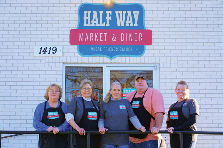 Faye Martin, Nellie King, Kellye King, Paul King and Patsy Bekurs pose outside the new Half Way Market & Diner location in Franklin
