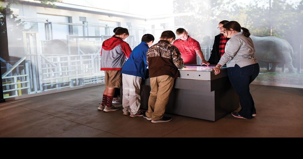 Joy With Chester County Middle School Students Surrounding Interactive