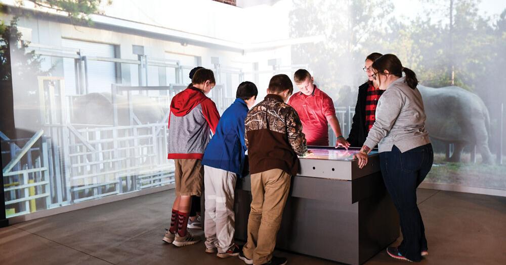 Joy With Chester County Middle School Students Surrounding Interactive