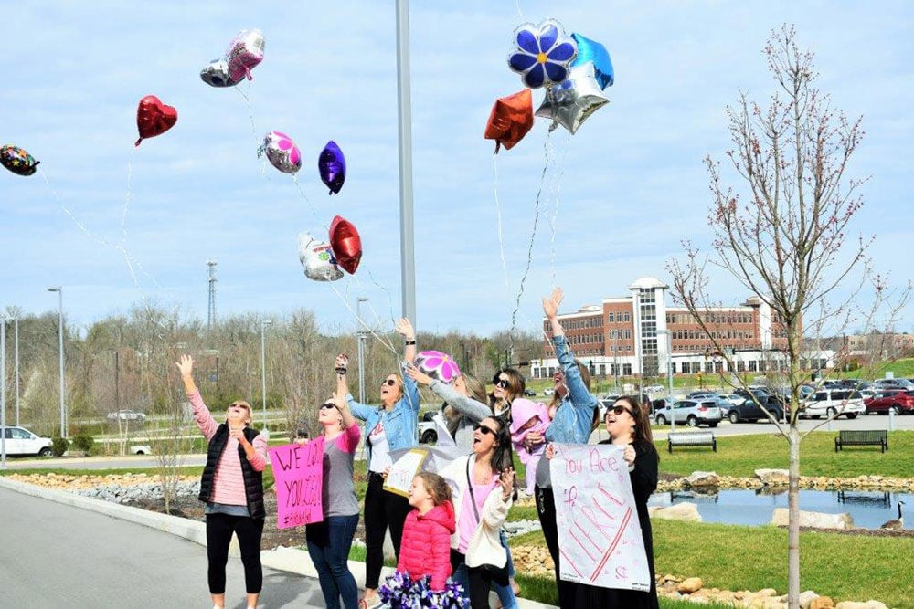 Teachers from Edmondson Elementary release balloons in support of Leslie George as she undergoes chemo at Tennessee Oncology.