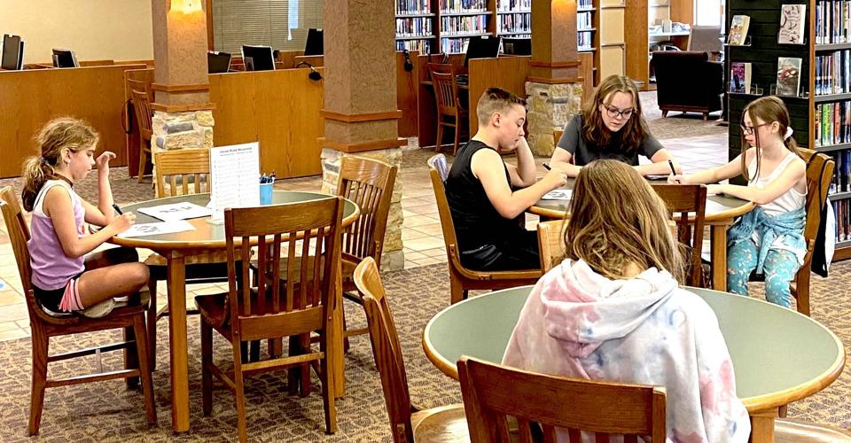 Kids at Le Sueur Library explore dragons and runes Community
