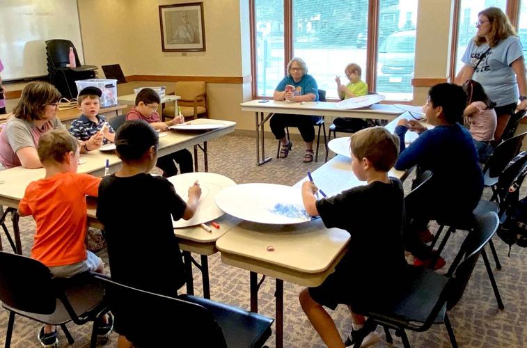 Kids at Le Sueur Library explore dragons and runes Community