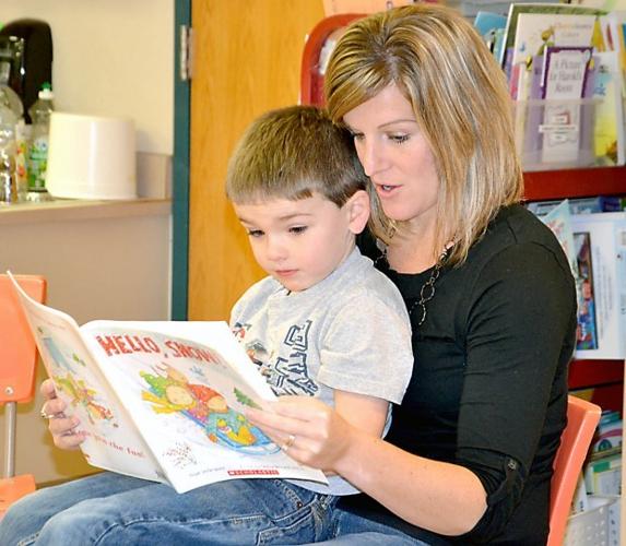 Blooming Prairie preschoolers enjoy books and muffins with parents