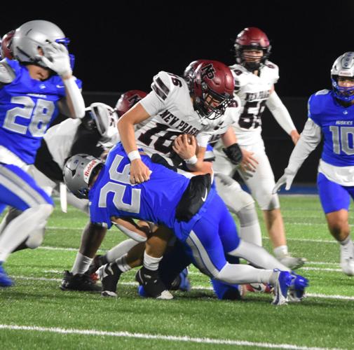 Huskies edge out victory against Trojans to move on to section ...