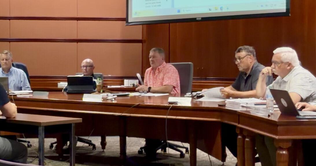Coroner's office put under spotlight at county meeting; Moore responds to criticism