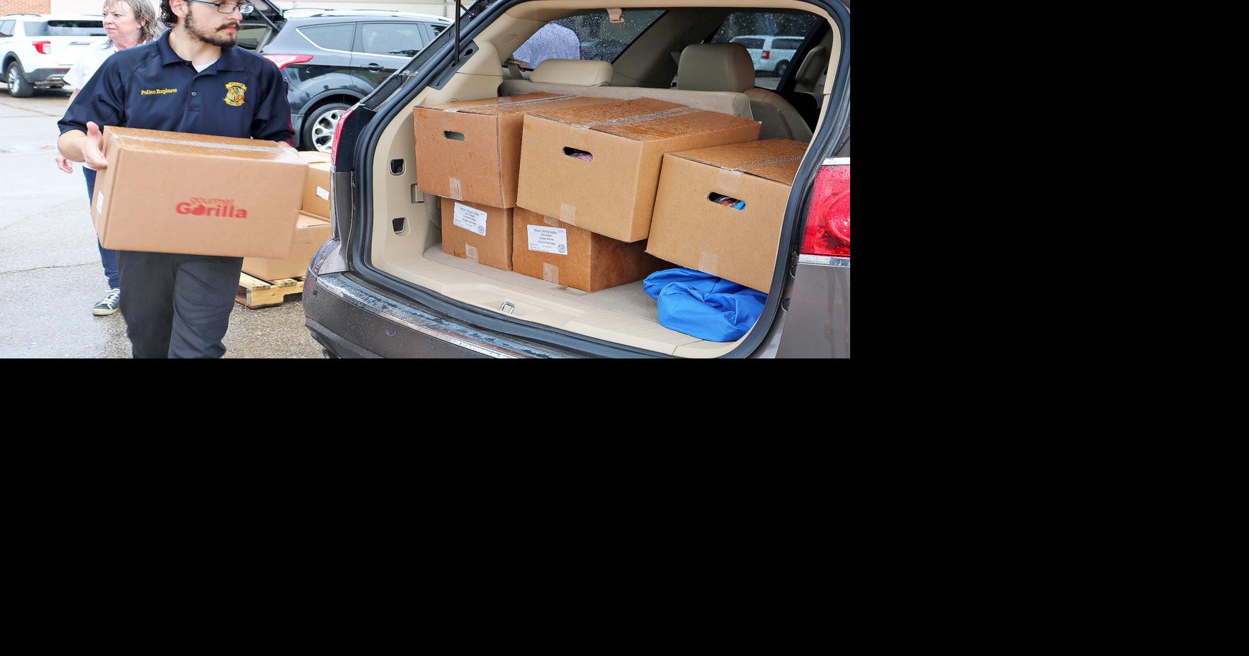 GALLERY: Truck to Trunk food shelf event dishes out federal food kits ...