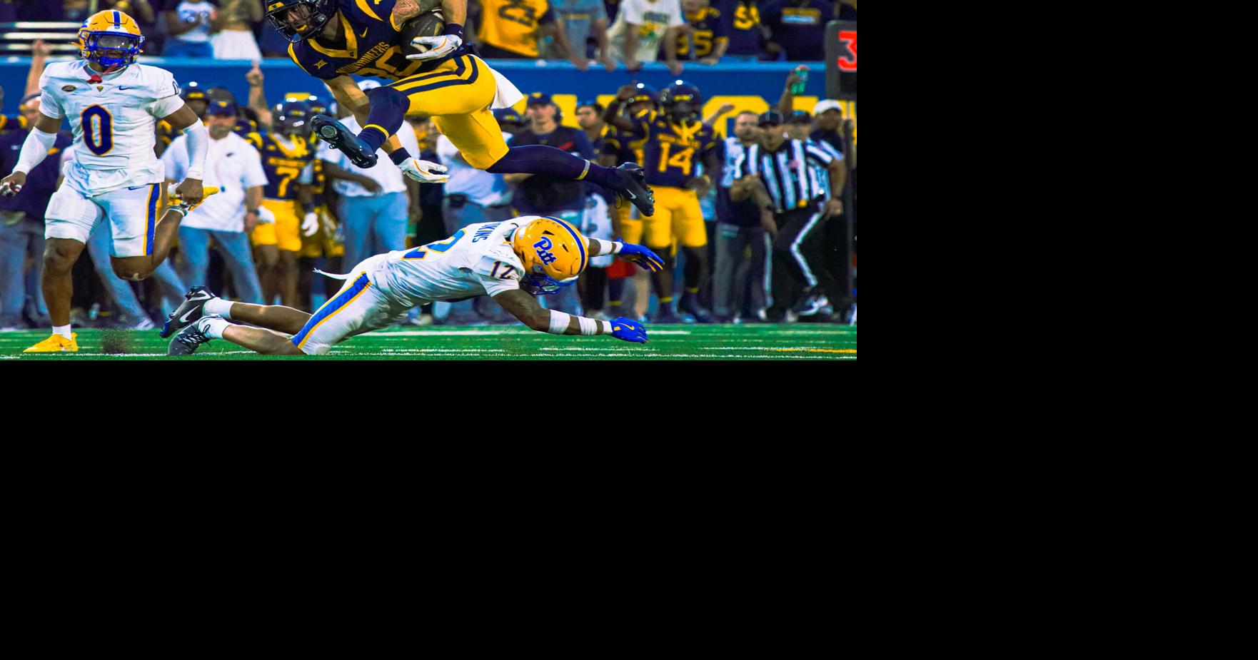 Mountaineers come back in final seconds of regulation, defeat Pitt 31-24 in overtime in Backyard Brawl