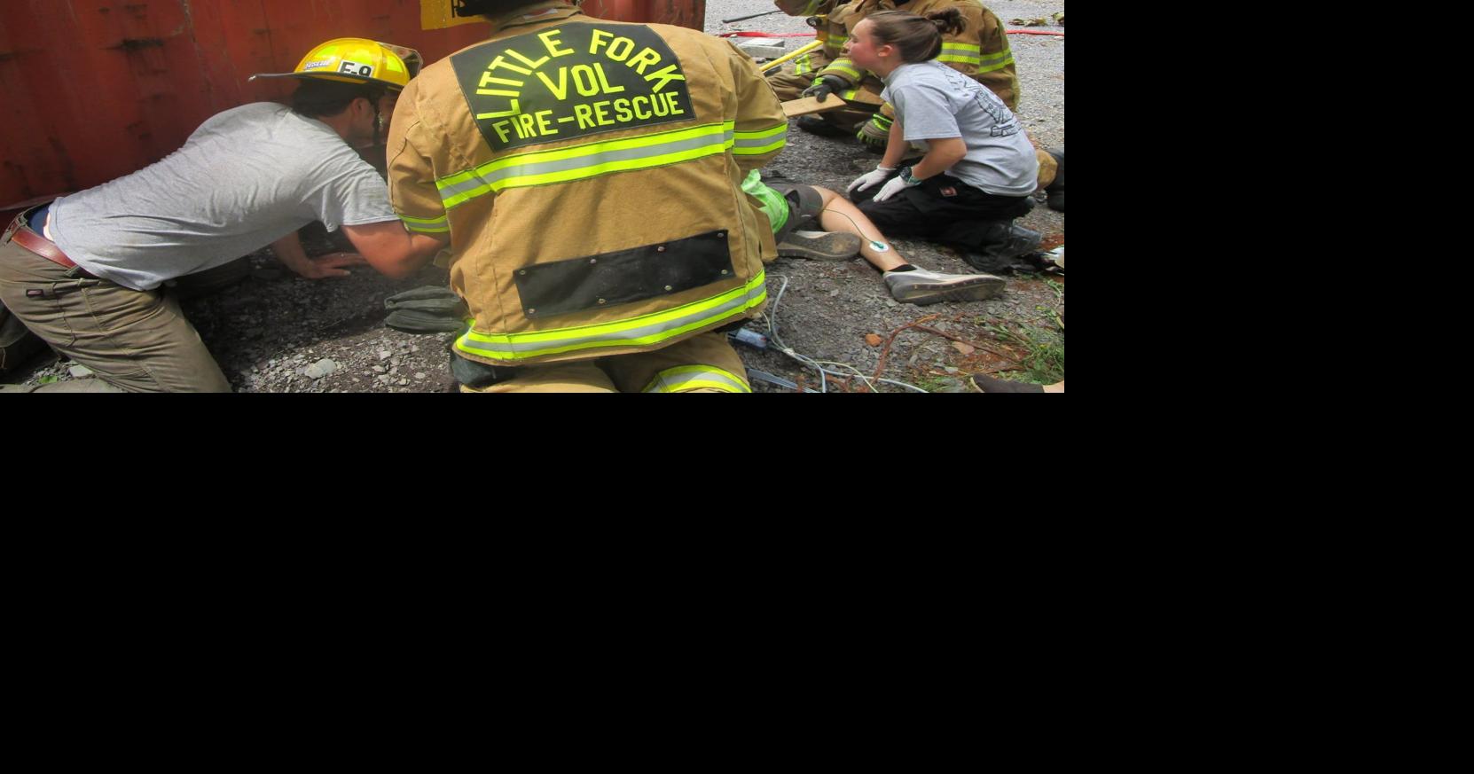 Little Fork VFD frees man's hand trapped by shipping container near