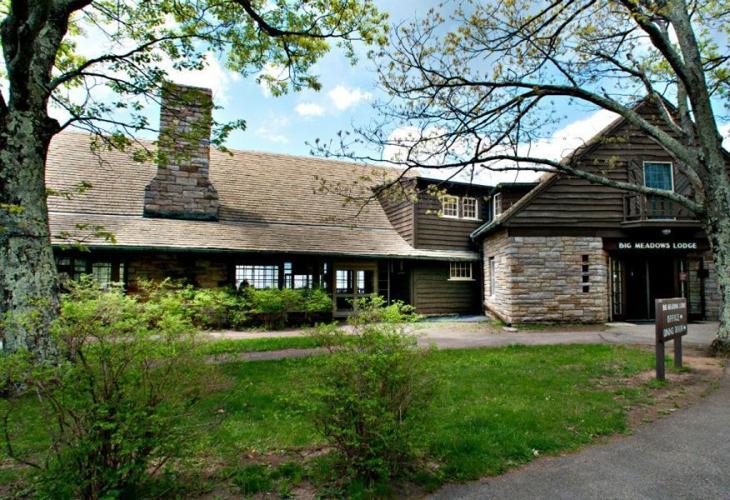 Fire destroys cabin on Big Meadows Lodge complex, snow falls on grassy