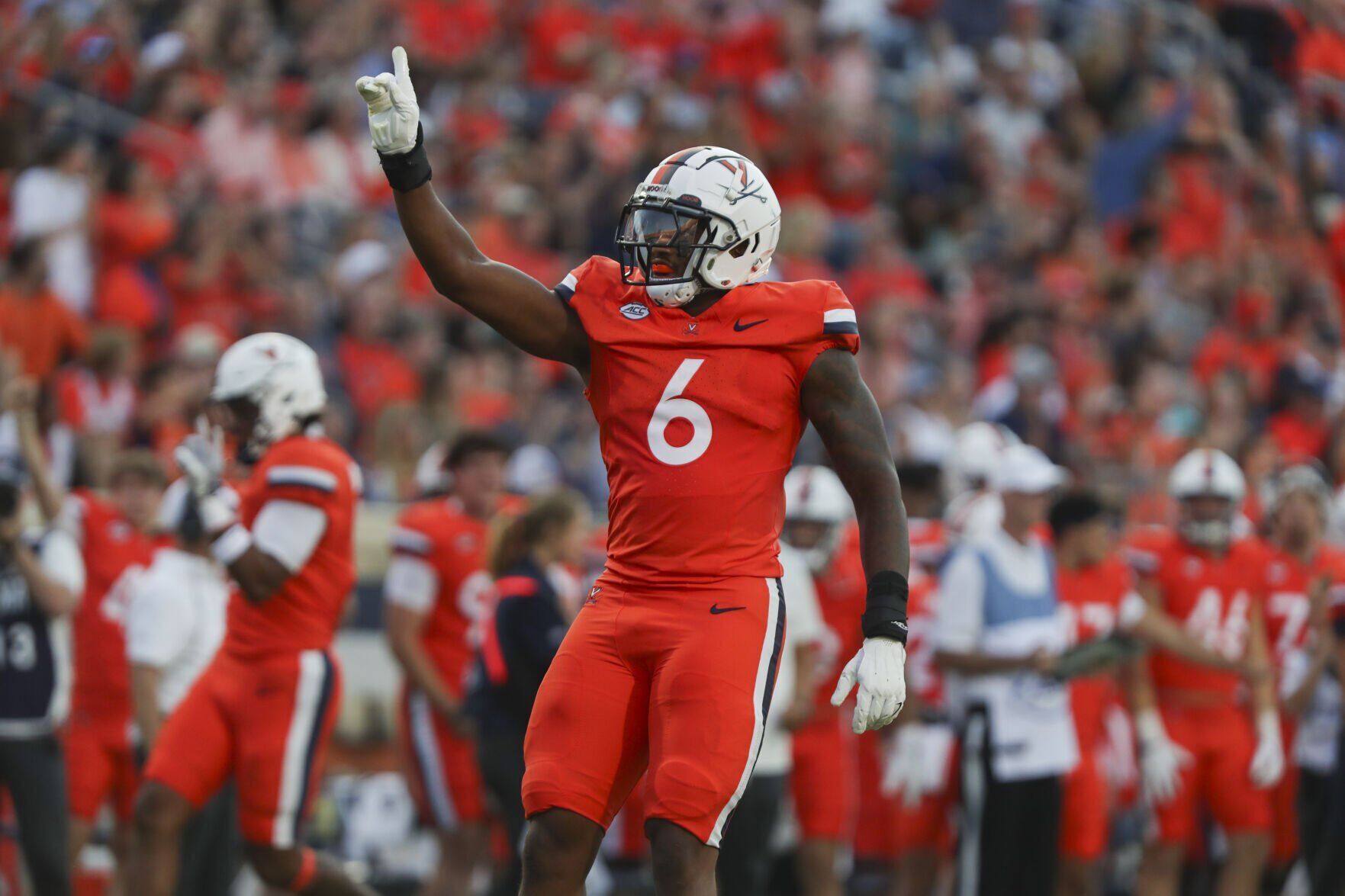Virginia defensive line aligning at Scott Stadium during an ACC football game