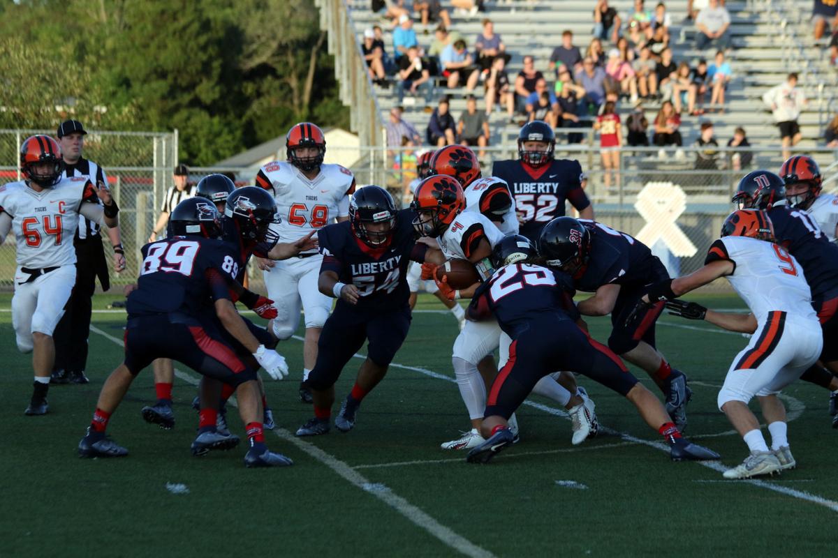 High School Football Liberty Overcomes Slow Start To Thump