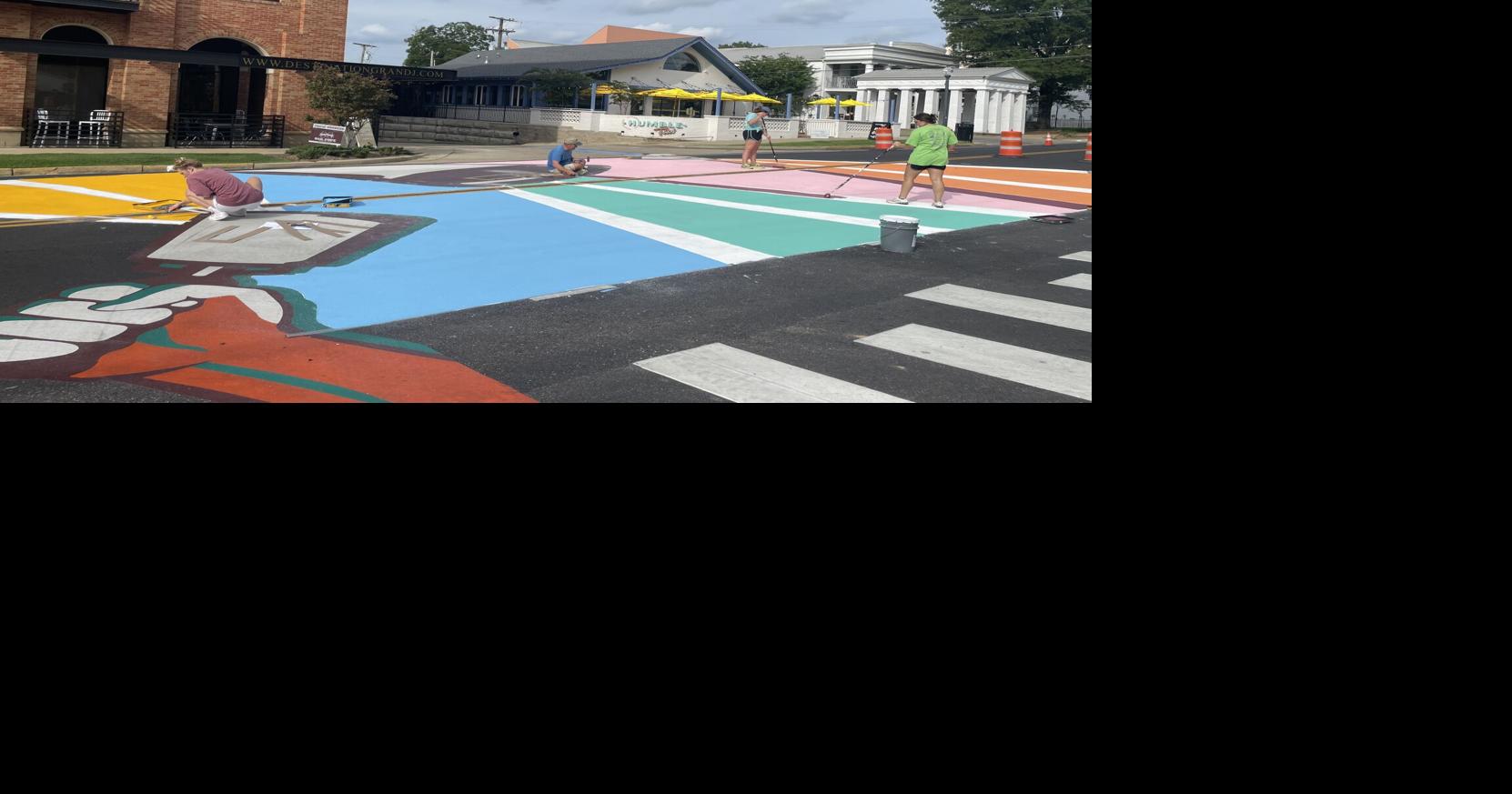 Cowbells and Paint Pails paints murals on University Drive News