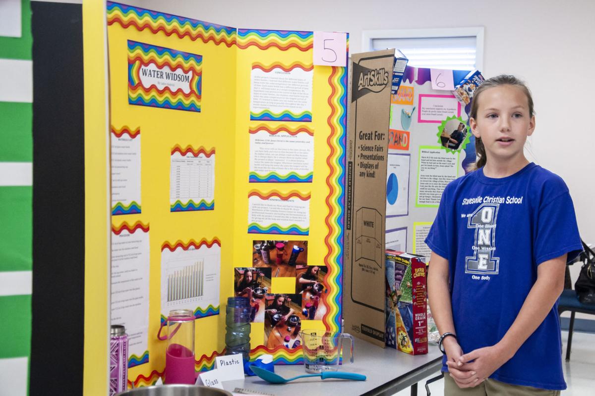 photos students present science projects at statesville christian